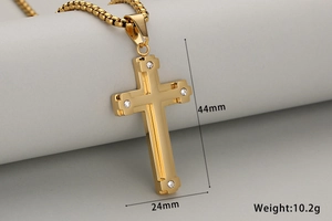Macro view of a gold double-layer cross pendant with dimensions 44mm by 24mm