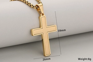 Detail of two-tone gold cross pendant with matte center and polished edges on box chain