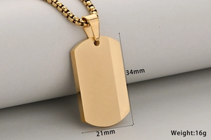 Macro view of gold stainless steel dog tag pendant with 34mm x 21mm dimensions