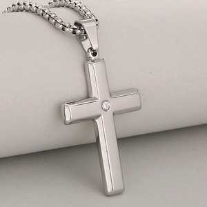 Polished stainless steel cross pendant with round cubic zirconia on a thick box chain