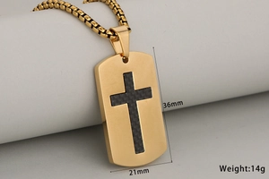 Detailed macro view of gold-plated cross pendant with black carbon fiber inlay and box chain