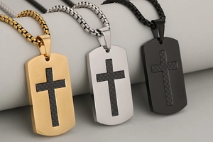 Three men's stainless steel dog tag necklaces in gold, silver, and black with cross inlay