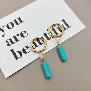 Golden hoop earrings with clear faceted crystal and blue turquoise stone pendant