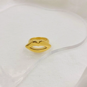 Detailed close-up of 18K gold-plated stainless steel ring with unique hollow lip design
