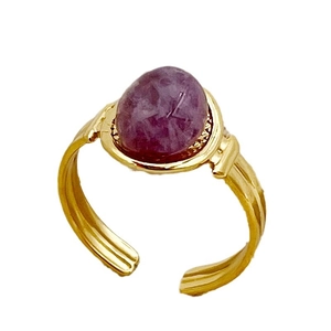 Vintage vergulde roestvrijstalen ring met ovale paarse edelsteen en getextureerde band