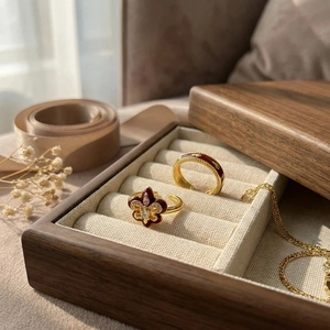 Detailed macro of vintage burgundy enamel iris rings set with gold floral accents