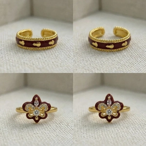 Detail of vintage iris flower ring with burgundy enamel and sparkling crystal accents