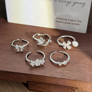 Elegant silver ring set with zircon bow, pearl flower, and butterfly for women