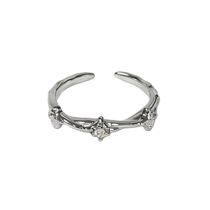 Adjustable silver leaf ring with zircon stones in a minimalist nature-inspired design