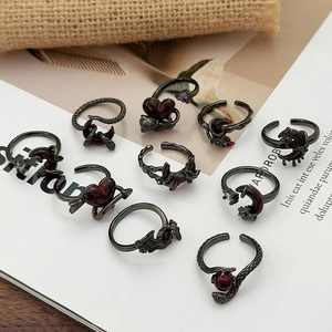 Gothic 10-piece black snake and heart ring set with dark red and purple gemstones