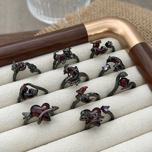 Gothic gun black snake and heart rings set with red and purple gemstones for layering