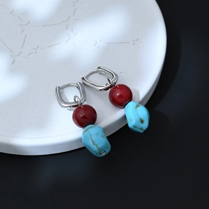 Ethnic bohemian drop earrings with red agate beads and turquoise stones on silver hoops