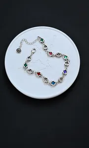 Detail of colorful enamel cross bracelet with S925 silver plated tag and chain link