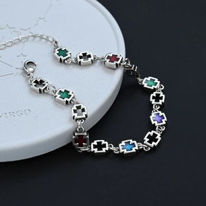 Colorful enamel cross charm bracelet in silver metal with glitter inlay and lobster clasp