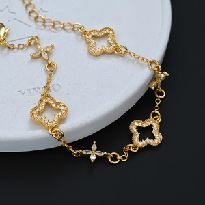 Elegant gold clover bracelet with sparkling white zircons and marquise crystals