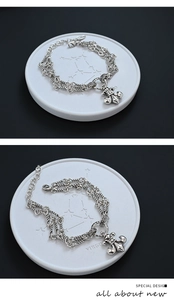 Detail of vintage silver S925 bracelet with fleur-de-lis pendant and Virgo engraving