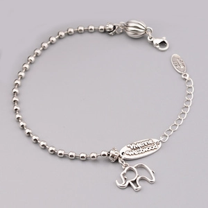 Macro detail of S925 silver beaded necklace with elephant pendant and clasp system