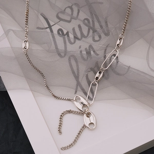 Silver multi-link tassel necklace with retro coffee bean charms and geometric chain design