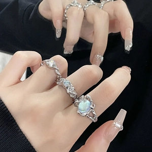 Minimalist silver moonstone rings set featuring irregular lava textures and twist designs