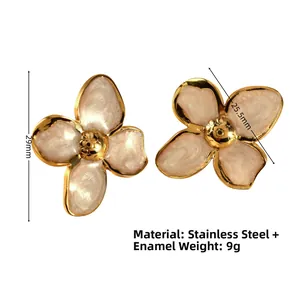 Detail view of 29mm gold stainless steel floral earrings with pearl enamel finish