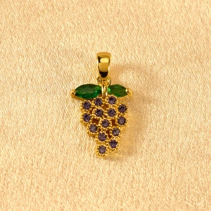 Detailed view of grape pendant with purple round crystals and green marquise leaves