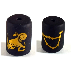 Detail of matte black zodiac beads with gold Aries and Capricorn icons for DIY jewelry