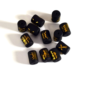 Matte black cylindrical zodiac beads with golden astrology symbols for DIY jewelry making