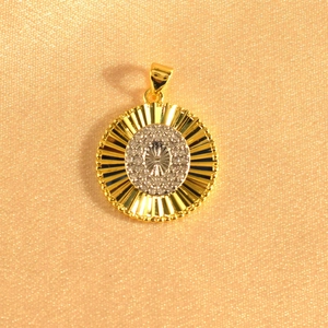Detail of gold sunburst pendant with starburst diamond setting and beaded edge