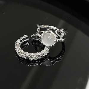 Irregular silver moonstone ring set with twisted texture and micro-pave zircon crystals