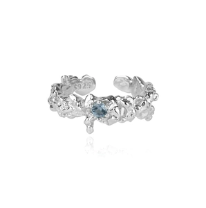 Bague en argent S925 texture lave avec une pierre de zircon bleu étincelante