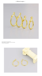 Detailansicht goldener Creolen im Vintage-Stil mit poliertem Finish und Federverschluss