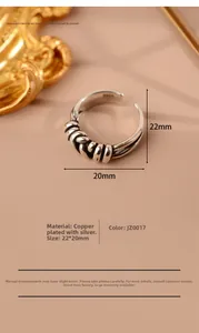 Detailed macro view of retro woven multi-layer silver plated ring with dimensions 22x20mm