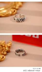 Detail view of twisted braided silver open ring with S925 engraving and vintage finish