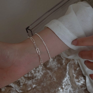 Elegant two-piece shimmering silver link bracelet and sparkling tennis chain for women