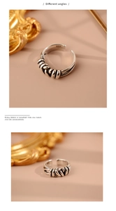 Detailed macro view of S925 sterling silver hallmark on retro braided twisted open ring