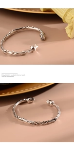 Detailed close-up of retro silver rose flower bracelet with vintage vine textures