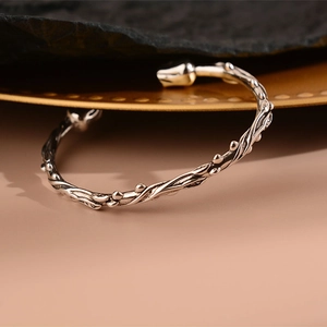 Vintage Thai silver open bangle with retro rose thorn and vine textured design