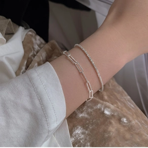 Elegant silver chain bracelet and textured cuff set for women in minimalist style