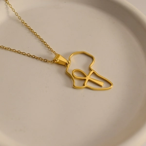 Close-up of gold stainless steel necklace featuring Africa map and Ankh cross pendant
