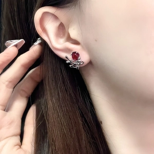 Minimalist moonstone rabbit stud earring with red gemstone and liquid silver design