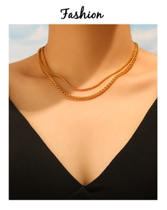 Close-up of dual-layer gold plated wheat chains showing glossy texture and detail