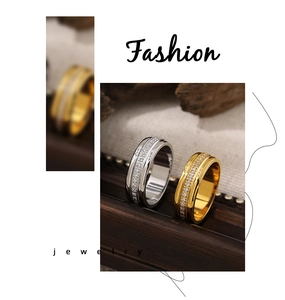 Detailed macro of 18K gold and silver polished rings with pave-set zircon stones