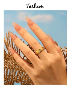Detail of 18K gold plated CNC ring with paved zircon diamonds on model's hand