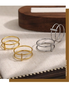 Detail of 24K gold plated double layer ring with sparkling rectangular zircon bar