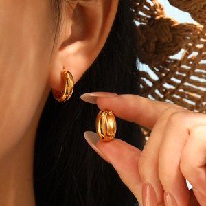 Minimalist golden titanium steel thick hoop earrings with a polished mirror finish for women