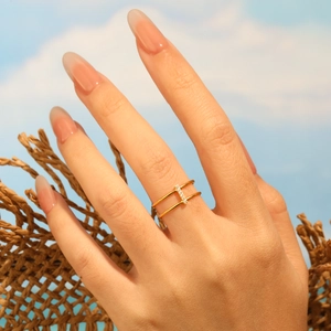 Minimalist double-layer 24K gold-plated ring with sparkling diamonds on a hand