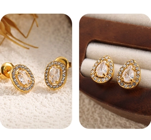 Detail of vintage 18K gold plated stainless steel stud earrings with teardrop zircon