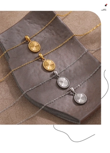 Detail of laser oval pendant necklaces in gold and silver with sunburst texture