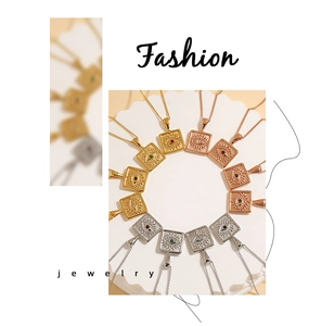 Detailed view of square evil eye pendants with radial texture in gold and silver finish