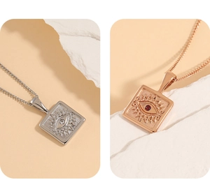 Detail of square evil eye pendant necklace in silver and rose gold over stainless steel